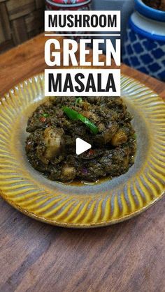 a yellow plate topped with green masala on top of a wooden table next to potted plants