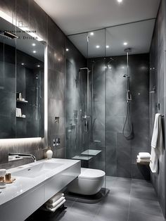 a modern bathroom with grey walls and flooring is pictured in this image, it appears to be very sleek