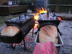 two breads are being cooked over an open fire pit