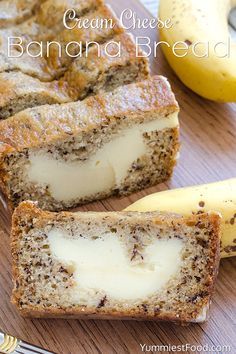 sliced banana bread with cream cheese on top and two bananas in the background next to it