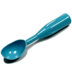 a blue spoon sitting on top of a white table