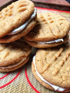 a pile of cookies with frosting on top