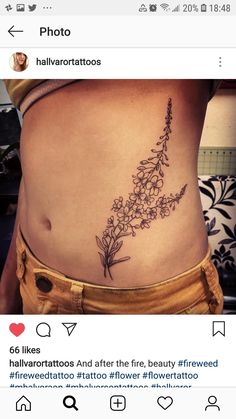 the back of a woman's stomach with flowers tattooed on her lower body and bottom