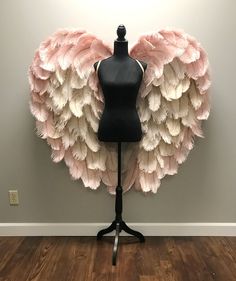 a mannequin with pink and white feathers on it