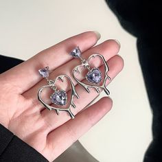 Cute Korean design earrings with a heart motif.



 Size: Approx. 3.5 x 2.2cm



 ■ Country of Origin: China

 ■Material
 
Piercing needle: 925 silver

 Other: Zinc alloy Piercing Needle, Purple Heart Earrings, Piercing Needles, Crystal Heart Earrings, Korean Design, Heart Motif, Heart Drop Earrings, Design Earrings, Rhinestone Heart