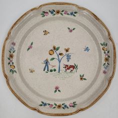 a decorative plate with an image of a farmer