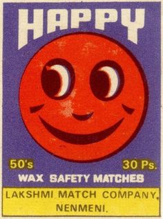 an old match card with a smiley face on it