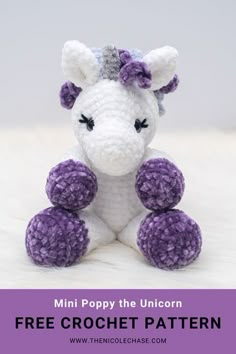 a crocheted unicorn sitting on top of a bed with the text, mini poppy the unicorn free crochet pattern