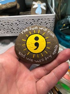 the sun will rise and we will try again painted on a rock by someone else