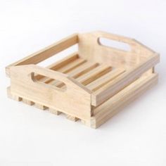 a small wooden tray with handles on it