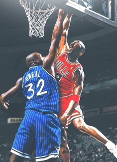 two basketball players in the air during a game