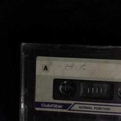 a close up of an old fashioned cassette with the word goldstar written on it