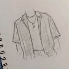 a drawing of a shirt on a notebook