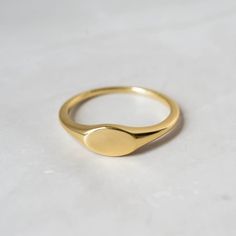 Dainty signet ring that is great for stacking or for a minimalist look!  - - - D E T A I L S - - - * Made of 925 Sterling Silver * THICK plating of 14k Gold or Rhodium * Available in sizes 4-12 * Nickel-free & Hypoallergenic  Comes in a cute box, ready for gift-giving! Made with 100% Pure Love! ♡ Happy to answer any questions you may have! 🥰 Let's Connect! 🥰 IG: samijewels_ Dainty Oval Stackable Signet Ring, Dainty Stackable Signet Ring With Round Band, Minimalist Initial Promise Ring, Dainty Stackable Open Signet Ring, Dainty Initial Ring With Polished Finish, Simple Tarnish Resistant Midi Rings For Everyday, Simple Tarnish-resistant Midi Rings For Everyday, Simple Everyday Tarnish Resistant Midi Rings, Adjustable Dainty Signet Ring