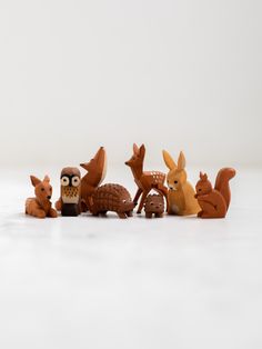 a group of toy animals sitting next to each other