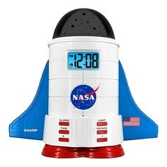 a clock that is on the side of a toy rocket with nasa written on it