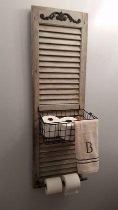 an old window is used as a towel rack