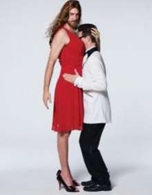 a woman in a red dress and a man in a white coat