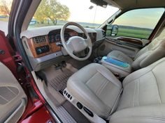 the interior of a vehicle with leather seats