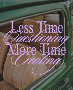 a green car with the words less time questioning more time creating on it's side window