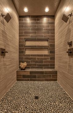 a walk in shower sitting next to a tiled wall and floor with leopard print on the floor