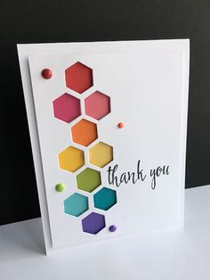 a thank you card with colorful hexagons on it