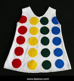 a child's dress made out of felt with different colored dots on the back