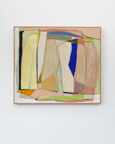 an abstract painting hanging on the wall