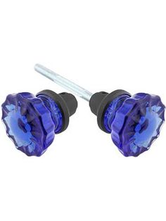 pair of blue crystal heart shaped ear plugs with black metal posts on white background