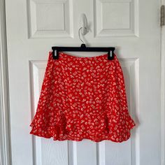 Beautiful Floral Mini Skirt With A Ruffled Hem. New With Tags! Skirt Is Lined And Has A Zipper In The Back. Perfect For Summer! Open To Reasonable Offers! Red Flowy Tiered Mini Skirt, Red Tiered Mini Skirt With Floral Print, Red Floral Print Tiered Mini Skirt, Red Tiered Mini Skirt With Lining, Red Tiered Ruffled Mini Skirt, Red Floral Print Mini Skirt, Red Spring Mini Skirt, Red Mini Skirt For Spring, Red Flowy Mini Skirt For Spring