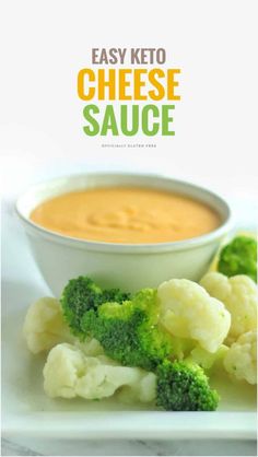 broccoli and cauliflower on a plate next to a bowl of cheese sauce