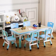 a child's table and chairs in a room