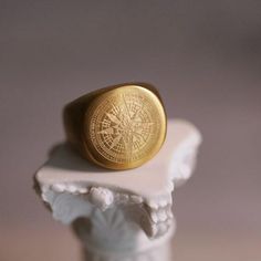 Discover your next favorite accessory with this stunning statement ring. The gold compass design, plated in 18K gold, exudes elegance while making a bold fashion statement. - **Material Crafted from high-quality stainless steel with a luxurious 18K gold plating - **Design Unique compass motif symbolizes direction and adventure - **Size Available in sizes 9-13, perfect for everyone - **Unisex A versatile design suited for all styles Ideal for gifting or adding flair to your own collection, this ring is a unique piece that tells your story. Don't miss out--elevate your style with a piece that truly stands out. Order now to secure your statement ring today! -- Shipping info --- - Complimentary ring sizer is sent with every order; - Free DHL/German Post tracked shipping worldwide; - Items are Plating Design, Compass Design, Gold Statement Ring, Ring Sizer, Ring Gold, Bold Fashion, Signet Ring, Statement Ring, Gold Plating