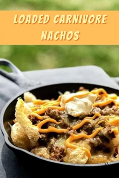 loaded carnivor nachos in a cast iron skillet with text overlay