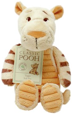 a brown and white stuffed animal with a tag on it's chest that says classic pooh