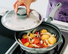 someone is cooking food in a pan on the stove