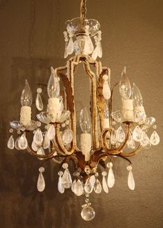 a chandelier hanging from the ceiling in a room