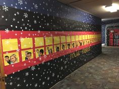 the hallway is decorated with pictures of people and snowflakes on the wall,