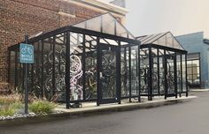 a glass building with bicycles on the side of it