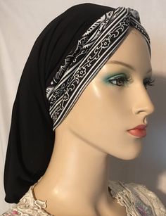 BLACK SNOOD with BLACK & WHITE DESIGN TURBAN BAND This elegant head covering combines a black snood with a front band featuring a captivating turban design in black and white. It is thoughtfully crafted for individuals seeking stylish and modest head coverings, as well as for women going through hair loss. Whether you're in need of a comfortable and fashionable addition to your wardrobe for everyday or special occasions, require a religious or modest attire, or need it for medical reasons such as thinning hair or hair loss due to cancer or chemotherapy, this snood is the perfect choice. This snood is designed for easy and comfortable wear, allowing you to effortlessly put it on and take it off. Crafted from a lightweight and premium blend of polyester and lycra, it ensures a soft and comfo Modest Attire, Hair Snood, Black White Design, Head Coverings, Modest Wear, Thinning Hair, Black And White Design, Head Covering, White Design