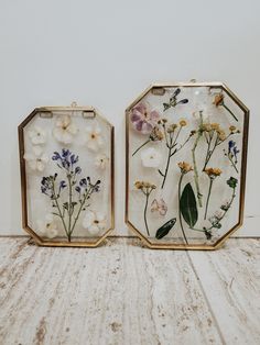 two glass trays with pressed flowers on them