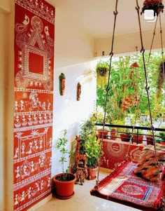 the room is decorated with colorfully designed wall hangings and potted plants in pots