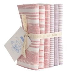 a stack of pink and white striped towels