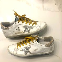 Limited Edition Silver Glitter With Gold Laces. What More Can A Woman Ask For Please Note- These Shoes Were Naturally Distressed When I Purchased Them. Shoes Golden Goose, Goose Shoes, Golden Goose Shoes, Gold Lace, Golden Goose, Silver Glitter, Womens Shoes Sneakers, Limited Editions, A Woman