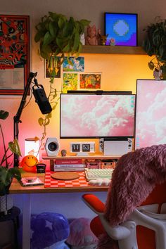 a desk with two computer monitors and a chair in front of it, all covered by pink fur