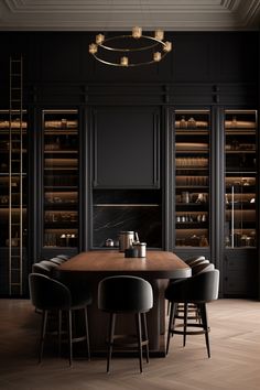 an elegant dining room with black walls and wooden floors