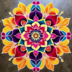 a colorful flower design painted on the ground