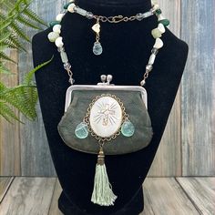 Bh Original Design Necklace Assembled Using A Vintage Leather Count Purse Adorned With A Vintage Abalone And Mother Of Pearl Shell, Green Quartz Briolette Beads, Cotton Tassel, And Hung From Mother Of Pearl, Jade, Green Quartz, And Vintage Aurora Borealis Crystal Beads. Measures 26” Long Assemblage Jewelry And Wearable Textiles Are Made Using Pre-Loved Pieces Of Jewelry, Toys, Artifacts, Vintage Fabrics, And Anything Of Interest! They Also Might Show Signs Of Wear. They May Be Discolored, Missha Treasure Necklace, Xo Necklace, Letter Necklace Silver, Wooden Bead Necklaces, Bling Necklace, Crystal Jewelry Sets, Aurora Borealis Crystal, Assemblage Jewelry, Glass Pendant Necklace