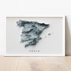 a framed map of spain with the name and shape in black ink on white paper