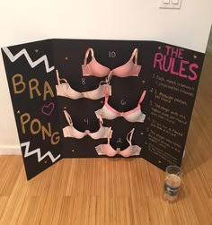 the bra pong rules are on display in front of a black board with pink bras